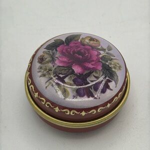 Vintage round metal pill box with floral print